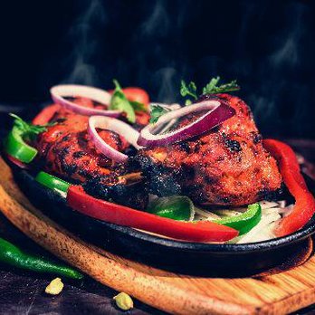 Marigold fine Indian cuisine signature dishes Tandoori Lamb ChopsSea Bass TikkaChicken Tikka Masala